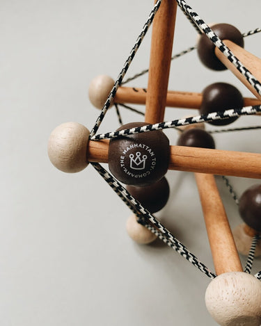 Skwish Rattle in Dark Brown from Manhattan Toy Company